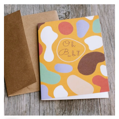 Card by AYA paper. White, orange, blue, green, brown circular shapes with the words Oh Baby on the front, blank inside. Comes with a kraft envelope.